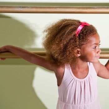 Little ballerina in dance studio
